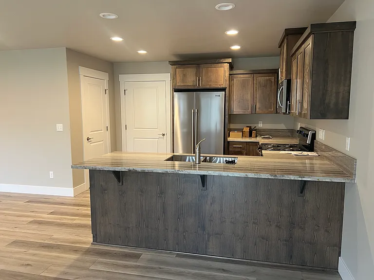 Kitchen with door leading to garage and a pantry