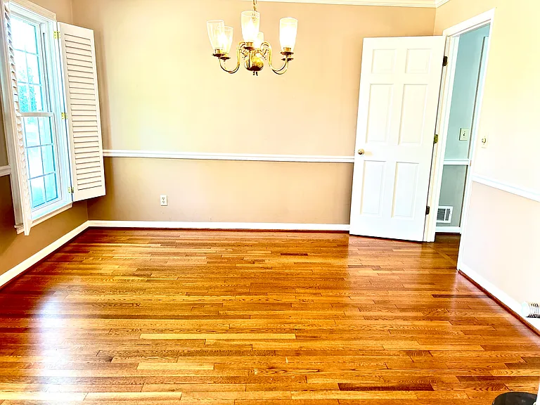view to the dining room at the main floor where is has access to the kitchen and the foyer.