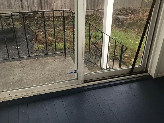 Exit to fenced yard from 3 season porch