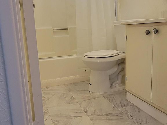Bathroom with new toilet.
