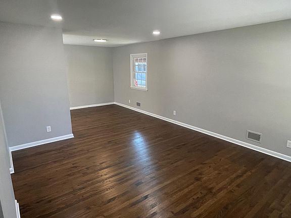 Enter into the large open living room with recessed lights