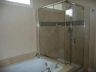Travertine shower and soaking tub.