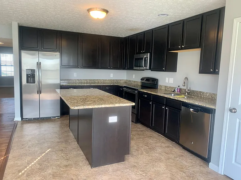 Kitchen- granite counter tops, stainless steel appliances, 42 inch cabinets