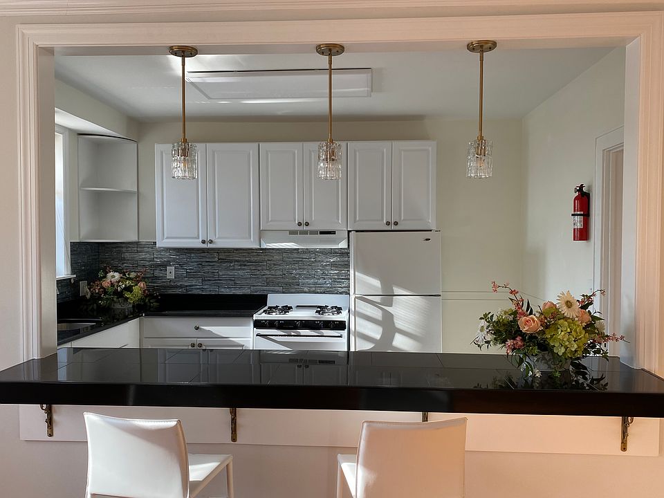 crystal pendants over black granite counter