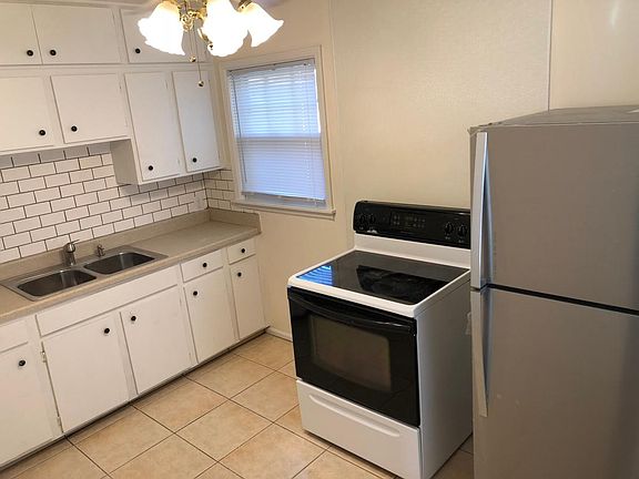Updated kitchen with stainless refrigerator