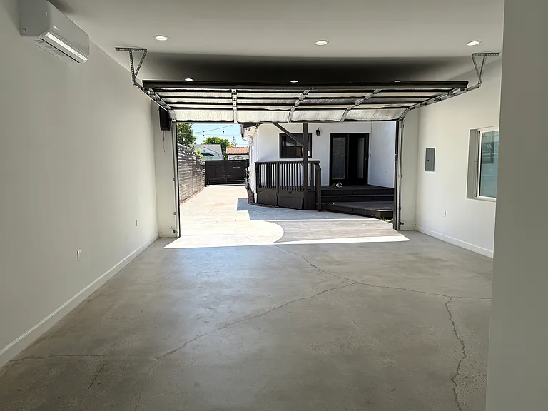 Remodeled detached garage with a large window, full bathroom, separate entrance, heating and air conditioning, dimmable recessed LED lighting, and approximately 545 square feet. Ideal for a home office, gym, creative studio, media room, playroom, etc.