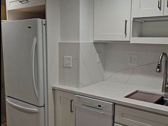 New dishwasher, countertops, and kitchen sink