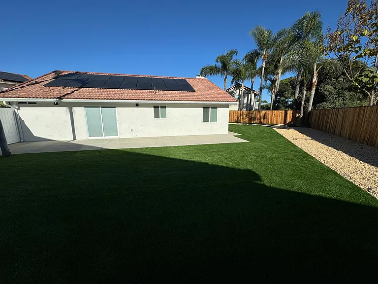 Immaculately landscaped yard with fenced in backyard. Solar panels for your utilities, Brand new roof,