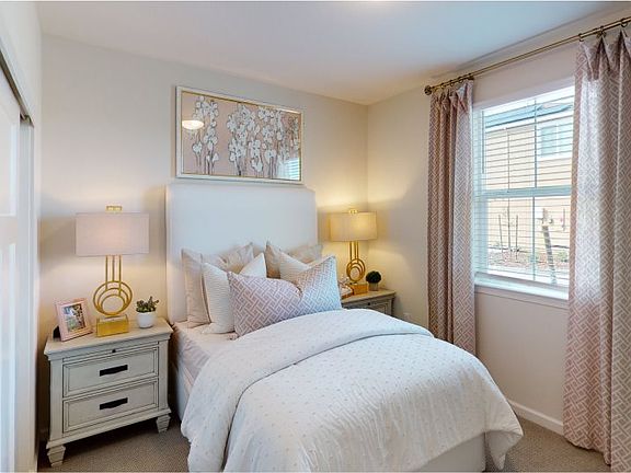 Located downstairs with convenient access to a secondary bathroom, this bedroom is great for overnig