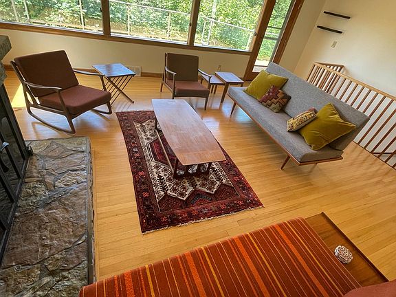 All furniture is high quality refurbished mid-century pieces, mostly teak. Gas fireplace warms up the room great in the winter!