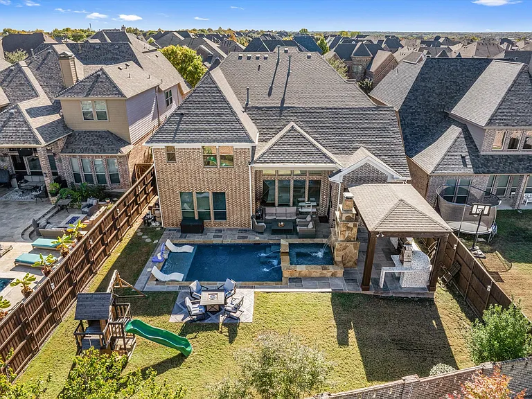 The Magnificent Resort Style Oasis backyard features a heated pool & spa combo, covered pergola, outdoor chef kitchen, and seating areas with a playground for the kids. The ultimate entertainment backyard for any age for the ultimate enjoyment.