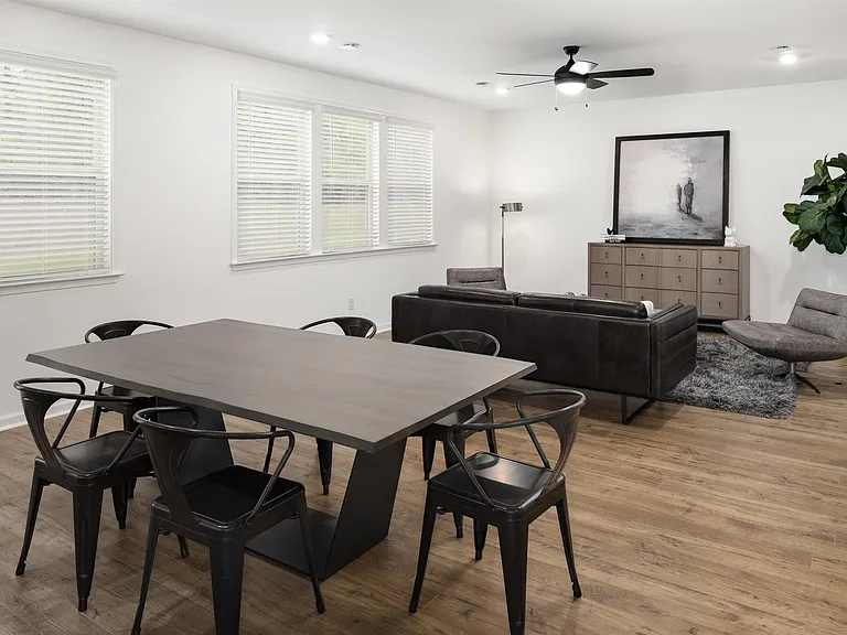 Living room with open view to kitchen.