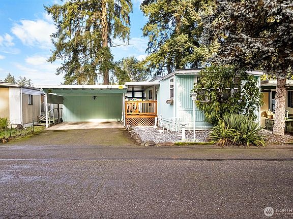 The home has a newer roof and a 2-car carport to keep you dry on rainy days. 4 total cars can fit in the driveway which makes it convenient for your guests.>