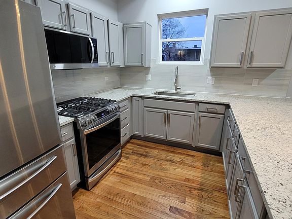 All new, modern, premium kitchen appliances: gas range, built-in microwave, premium refrigerator