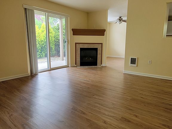 Living Room view of fireplace & Sliding door to patio