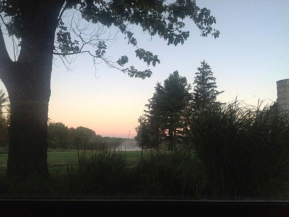 View to pond and sunset from porch