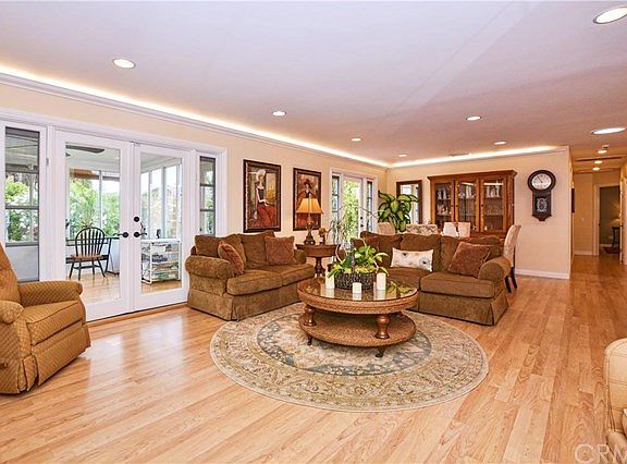 Living area with Sunroom to the left and Dining area to the right rear.