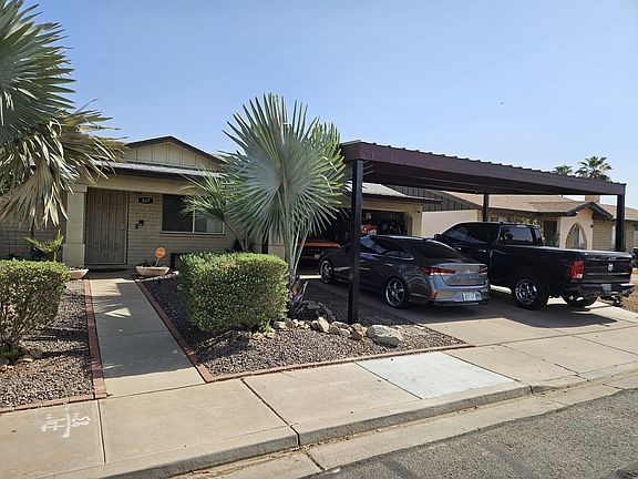 Large Carport to keep your cars in the shade.