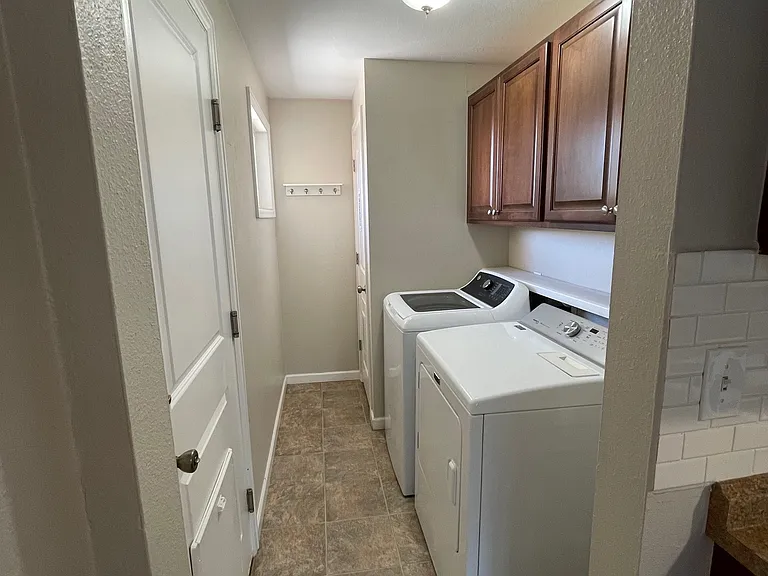 Nicely organized out laundry room.