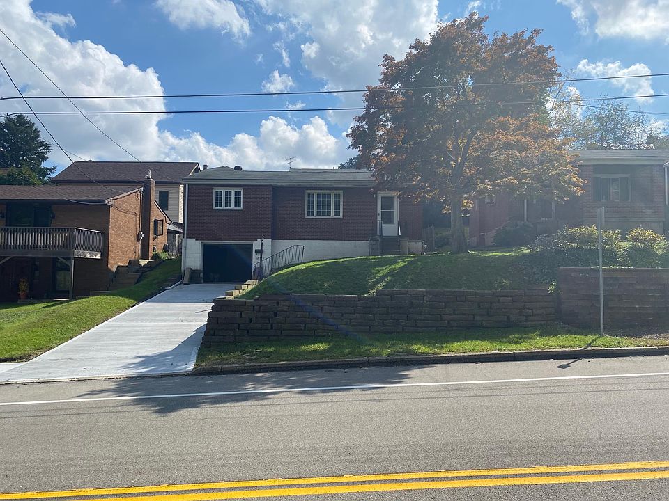 Front of the house, driveway, sidewalk to front door