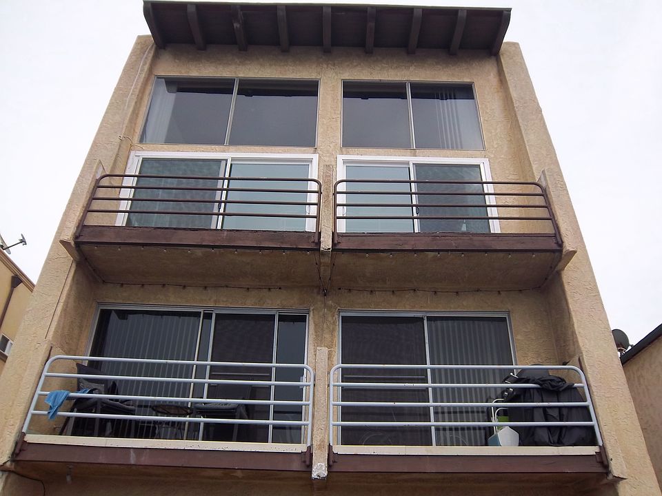 Front of 2 units, each with 2 car garage