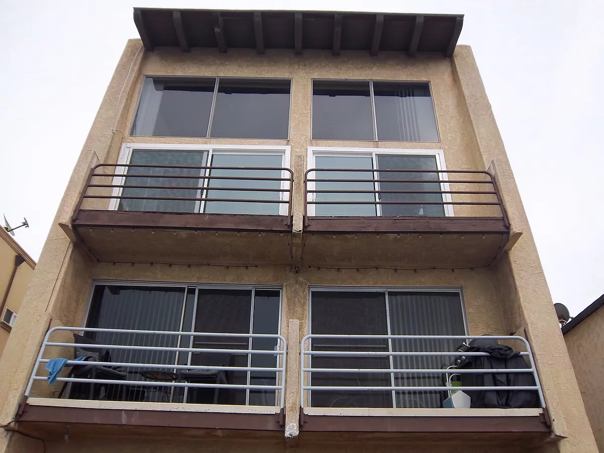 Front of 2 units, each with 2 car garage - 1037 Manhattan Ave #1037