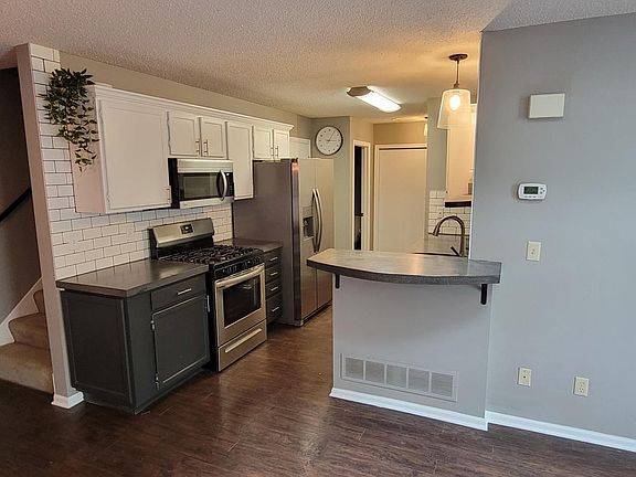 Brand new stainless steel appliances, updated cabinetry and custom concrete countertops throughout the house