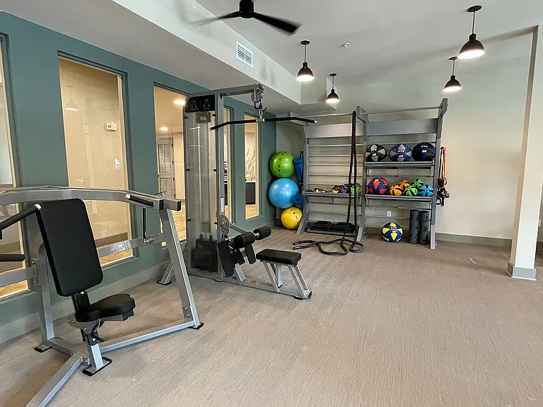 Elevate your fitness routine in our fully-equipped, vibrant apartment gym.
