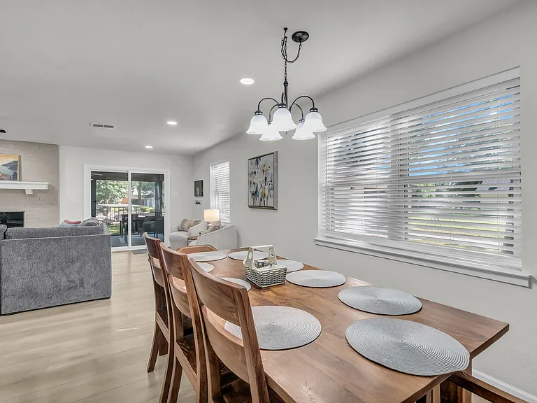 Seating for 8 at the dining table, 4 barstools and plenty more in the screened in porch area... a favorite!