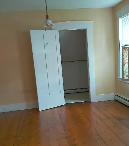 master bedroom with walk-in closet