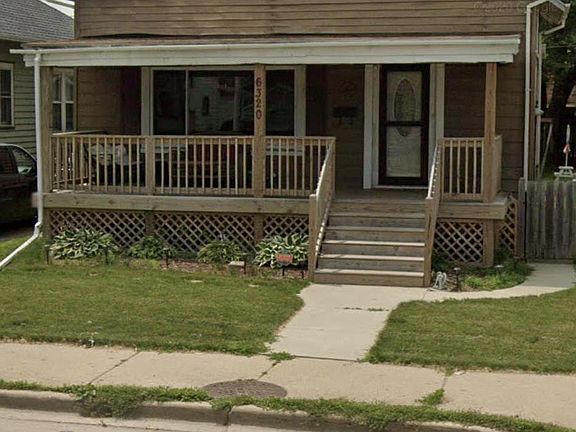 Front of home. New siding is being put on.