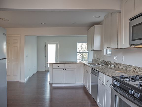 Kitchen, viewing to living room and front door