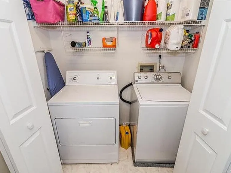 Built-in Laundry room with shelving and its own lighting