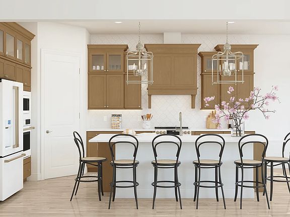 Kitchen with glass upper cabinets and pendant lighting