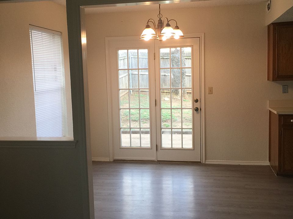 Separate dining area leads to patio and backyard.