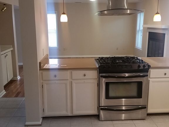 Kitchen looking into tv room