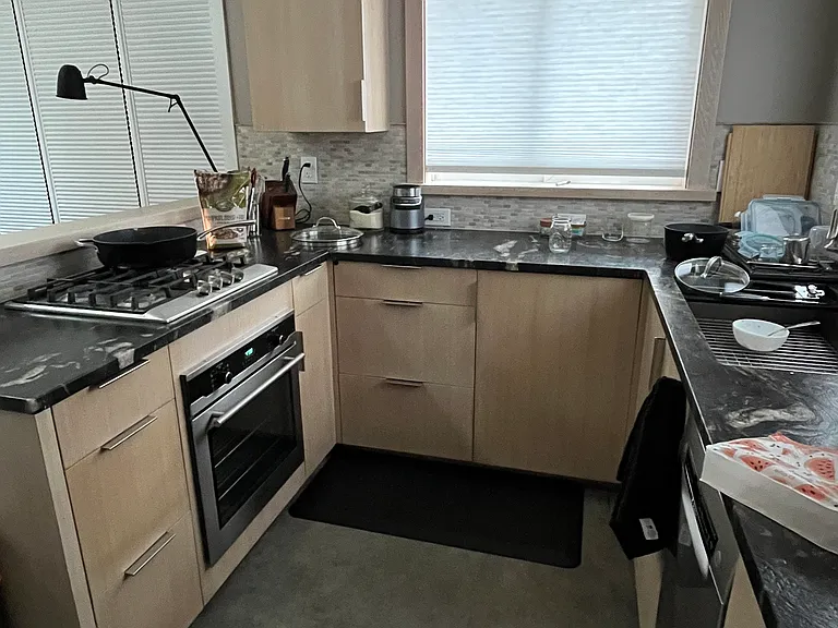 Very well lit & spacious kitchen, w/ large granite prep area; ss sink; d/w; convection oven; & gas cooktop.