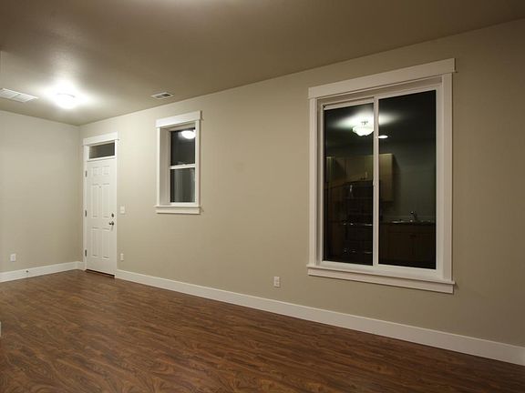 Front door (left side of photo) to side of house.