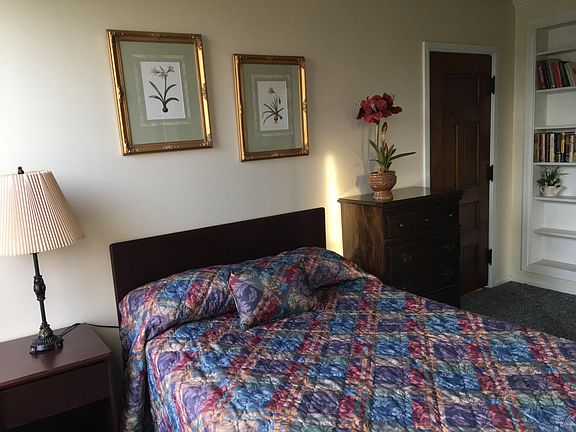 Bedroom with built in shelves and master bath