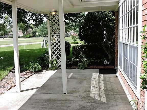 Covered back porch area looking out over the golf course