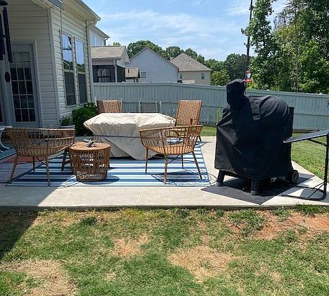 Large fenced in yard with patio (furniture and grill not included)