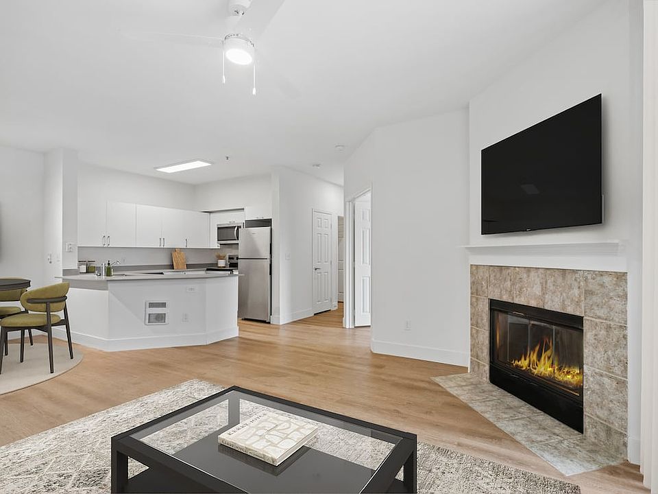 Renovated Package I kitchen and living room with hard surface flooring
