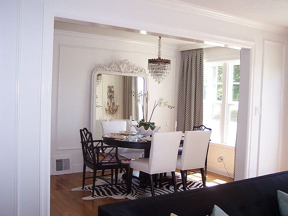 light and bright dining room with beautiful trimwork