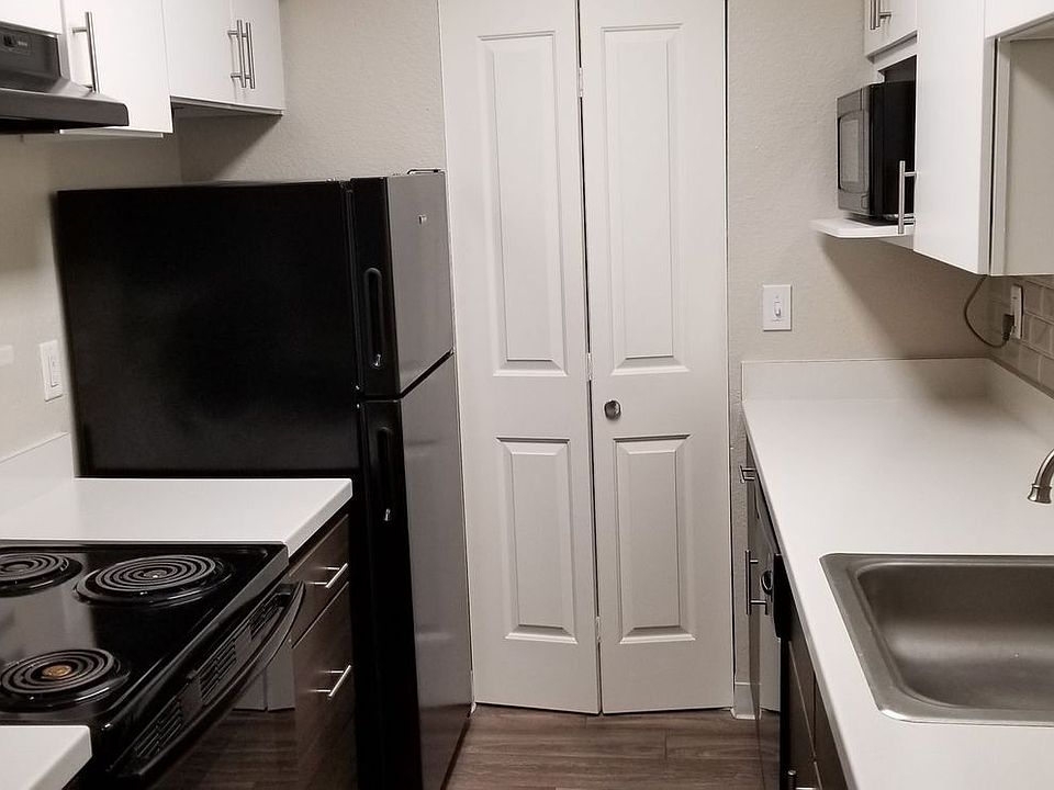 Avery Belmar - Upgraded kitchen with a glass tile back splash.