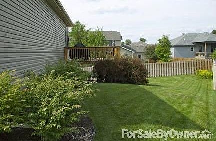 Side yard
						:
						Burning bushes, rhododendrons, & summer wine bushes line the east side.