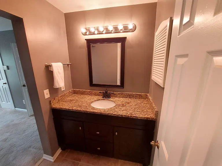 Primary vanity helps you create the day ahead or unwind afterward. Great storage, undermount sink. Cabinet storage.