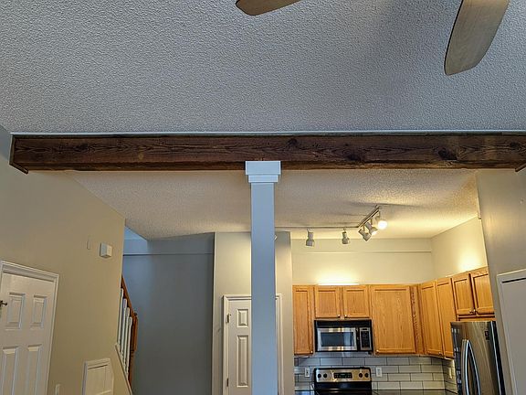 Restored hundred year old structural beam from when building was a the Byrum lumber company.