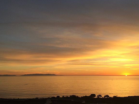 Front window view/ sunset over Pacific Ocean