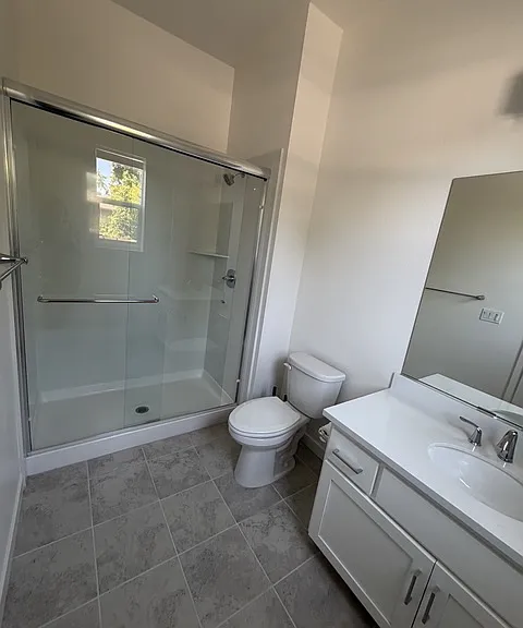 Bathroom with tile floor and spacious shower