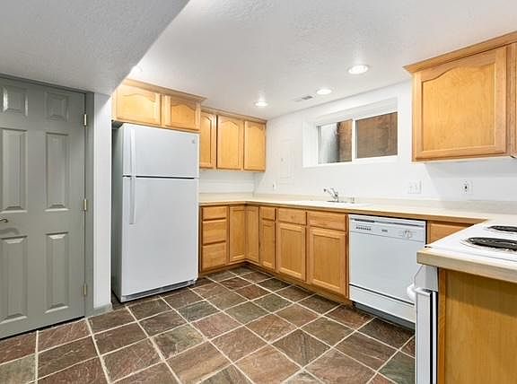 Kitchen includes newer appliances, large pantry, disposal, dishwasher and electric range.
